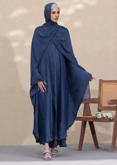 Abaya & Hijab set for Women. Description : Abaya : Pleated full length abaya with V neckline and button through opening. Full sleeves. Hijab : Basic hijab in soft and breathable korean chiffon fabric. Measurement 28”x 82”. Material : Korean Chiffon Color: Blue Abaya, Blue Hijab Country : Made in Pakistan Modest Dabka Abaya For Eid, Abaya Pleated, Blue Korean, Blue Abaya, Blue Hijab, Abaya Outfit, Abaya Hijab, Kaftan Abaya, Islamic Dress