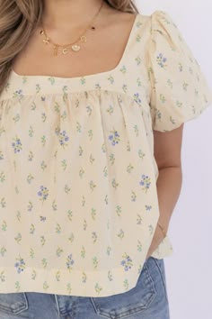 Description Elevate your wardrobe with our delicate DAINTY FLORAL BABYDOLL TOP. The skimmer babydoll top features a beautiful cream and blue floral print. The tie back adds a charming touch and allows for a customizable fit. Step into spring with style and grace! Material self: 100% cotton contrast: 100% polyester Size Chart Camille is in a small. Blue Flower Print Dress, Blue Flower Print, Floral Babydoll Top, Flower Print Dress, Puff Sleeve Blouse, Blue Floral Print, Style And Grace, Blue Baby, Babydoll Top