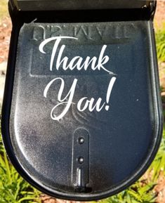 a black mailbox with the words thank you written on it