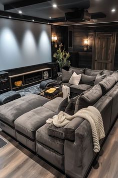 a living room with couches and a flat screen tv