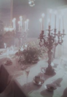 an image of a table setting with candles