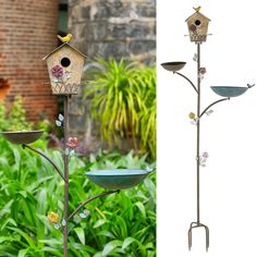 a bird house on top of a metal pole next to a garden with flowers and birds