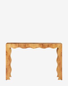 a wooden table with an intricate design on the top and bottom, against a white background