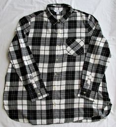 "Description: Up for sale is an Old Navy women's cotton flannel shirt. The size is 2XL. It is made of 100% cotton. This shirt is a tunic style with a plaid pattern in black & white. It has a full button front & cuffs with 1 breast pocket. It is in excellent condition. Please check the measurements before ordering. Bust (armpit to armpit) 27.00\" Sleeve Length (top of shoulder seam - bottom of cuff) 26.00\" Back Length (bottom of neck seam - bottom of shirt) 32.00\" Shipping: Merchandise will shi Black Flannel Shirt, Black Flannel, Tunic Style, Tunic Styles, Old Navy Women, Cotton Flannel, Plaid Pattern, Flannel Shirt, Womens Clothing Tops