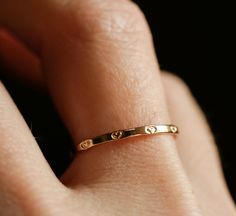 **PLEASE NOTE: This item is MADE TO ORDER. Current production times are listed in the announcement section of my shop's homepage. **Artist crafted. Original design made in Richmond, VA.** Dainty little heart band in your choice of solid 10k gold, 14k gold, 14k rose gold or sterling silver, all with a polished finish. Band is approx. 1.8mm wide. Sold individually. As each ring is hand stamped, please expect slight variations. **If unsure of your ring size, you can be easily measured at any local Dainty Crystal Rings, Gold Ring Heart, Dainty Rings Gold, Ring Designs Silver, Gold Simple Rings, Cute Promise Rings, Jewelry Hacks, Dainty Gold Ring, Ring Stacks