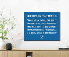 a blue sign that says our mission statement is provide an excellent guest experience at the lowest possible cost minimize profits for owners create opportunity