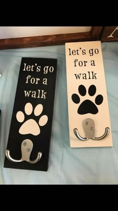 there are two signs that say let's go for a walk and dog paw