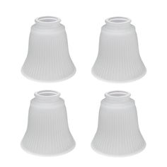 four white plastic lampshades on a white background