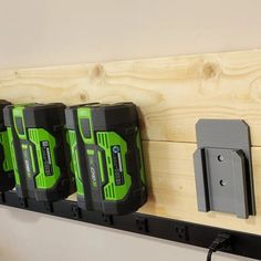 there are three green and black batteries on the wall