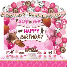 a pink birthday party with balloons and decorations