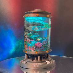 a fish tank sitting on top of a glass table