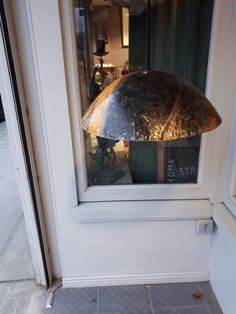 a lamp sitting in the window of a store