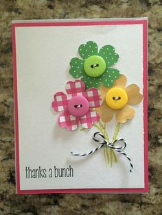 a card with buttons and flowers on it