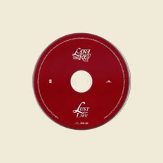 a red cd disc with the words lost tree written in white ink on it's side