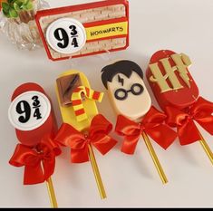 some lollipops that are decorated with harry potter characters and numbers on them