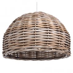 the light fixture is made out of wicker and has a round shape that matches it