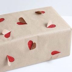 a brown paper bag with hearts on it