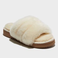 You won't want to take these off once you try them on; and honestly, we can't blame you. Featuring an over-the-top-soft combo of plush memory foam insoles and genuine shearling, your feet are sure to thank you when you slide on the Dluxe Betty One Band slippers. Naturally moisture wicking and with indoor/outdoor designs, they're a solid pick for relaxing on the go, too! Comfortable Faux Fur Slippers With Cushioned Footbed, Cozy Faux Fur Slippers With Cushioned Footbed, Indoor Slippers With Plush Lining And Faux Fur, Shearling Slippers With Faux Fur Lining And Round Toe, Shearling Slippers With Plush Lining, Indoor Faux Fur Slippers With Plush Lining, Comfortable Fluffy Sheepskin Slippers, Fluffy Comfortable Sheepskin Slippers, Fluffy Sheepskin Comfortable Slippers