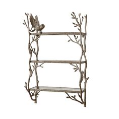 a metal shelf with branches and birds on it