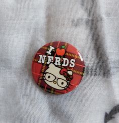 a button with the words nerds on it