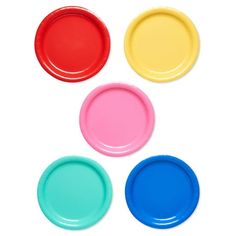 four different colors of plastic plates on a white background