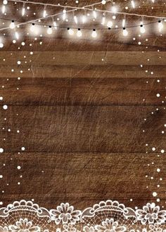 a wooden background with white lace and lights