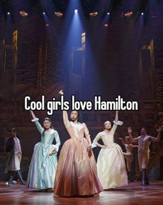 the cast of cool girls love hamilton on stage with their arms up in the air