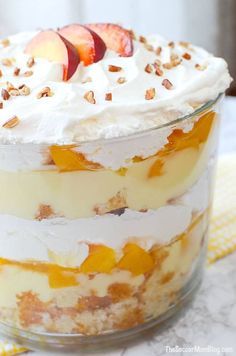 a dessert with fruit and whipped cream in a glass dish