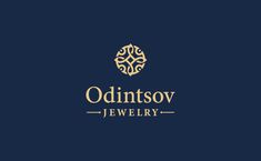 the logo for an upscale jewelry store, consisting of gold and blue colors on a dark background