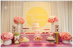 a table topped with lots of cakes and desserts