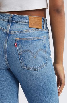 Inspired by cheeky vintage Levi's styles, these low-stretch jeans in a sanded medium wash hug the hips to showcase your curves to greatest effect. Distressed hems add lived-in character to the casual look. 15" leg opening; 11" front rise; 14 1/2" back rise (size 29 x 28) Button fly 99% cotton, 1% elastane Machine wash, tumble dry Imported Levi Wedgie Jeans, Big Wednesday, Levis Wedgie Jeans, High Waist Straight Leg Jeans, Wedgie Jeans, Wardrobe Ideas, Fall Wardrobe, Vintage Levis, Stretch Jeans