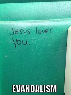 the words jesus loves you are written in black ink on a green wall next to a white door