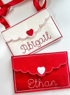 two personalized valentine's day gift bags, one red and the other white