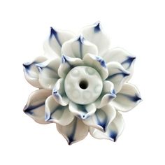 a white and blue ceramic flower on a white background