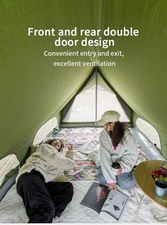 two people are sitting in a tent with the door open and one person is reading