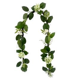 the letter n is made up of flowers and greenery on it's sides