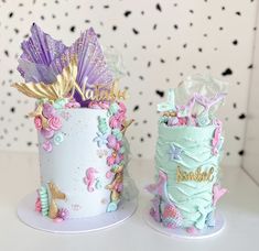 there are two cakes decorated with mermaid decorations