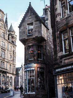 an old building on the corner of a street