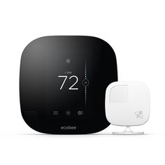 an ecobee smart thermostaer next to it's base