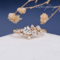 three stone engagement ring set in yellow gold