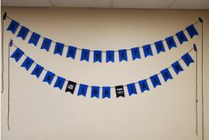 there is a blue bunting banner hanging on the wall