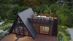 an aerial view of a house in the woods