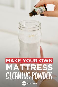 a person is holding a bottle with some liquid in it and the words make your own mattress cleaning powder