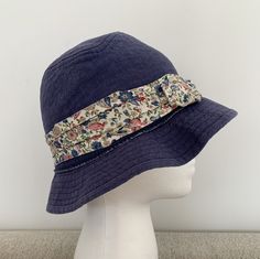 Nautica Girl’s Denim Bucket Hat - Blue Floral- One Size- suggesting fitting 6-9T. Garment manufacturer label removed. Dry-cleaned. In very good preloved condition. Summer Denim Blue Bucket Hat With Curved Brim, Denim Blue Bucket Hat With Curved Brim For Summer, Brimmed Denim Blue Bucket Hat For Summer, Denim Blue Curved Brim Bucket Hat For Summer, Denim Blue Wide Brim Bucket Hat For Beach, Denim Blue Cotton Hat For Beach, Spring Denim Blue Hat, Adjustable Denim Blue Bucket Hat For Summer, Navy Cotton Brimmed Hat