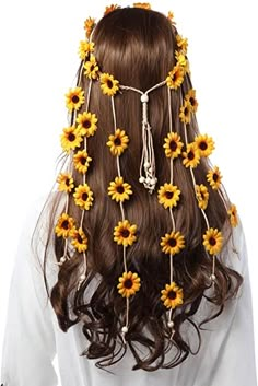 a woman with sunflowers in her hair