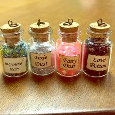 four small glass jars filled with different types of candy