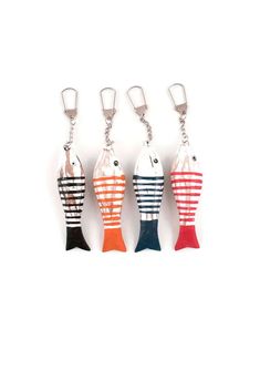 four different colored fish shaped key chains