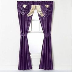 purple curtains hanging on the side of a window