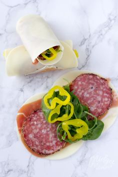 an italian roll with meat and cheese on it is shown in the appliance