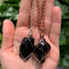 "☾ Raw Black Obsidian Pendant ☾ High quality, rough obsidian in its raw form in a secure & subtle setting that highlights the stone These pendants come in pure copper or sterling silver. Choose from an adjustable Faux leather chord (vegan friendly) a matching 18\" pure copper chain or a matching 18\" sterling silver chain. Faux leather chords are \"vegan friendly\" because they are actually cotton made to look like leather. These chords are also tied to be adjustable so you can wear it at yo Black Obsidian Amulet Necklaces, Black Obsidian Amulet Necklace, Black Spiritual Crystal Necklace With Gemstone, Black Amulet Necklace With Natural Stones, Black Gemstone Crystal Necklace For Spiritual Use, Spiritual Black Crystal Necklace With Gemstone, Spiritual Black Gemstone Crystal Necklace, Black Hand Wrapped Necklace For Gift, Hand Wrapped Black Necklace For Gift